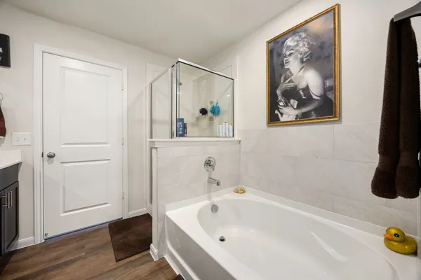 a bathroom with a tub and sink
