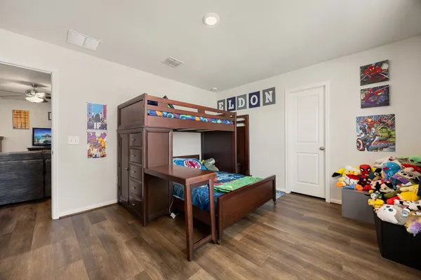 a bed room with a bed and furniture