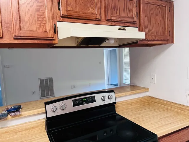 a kitchen that has a stove and a sink