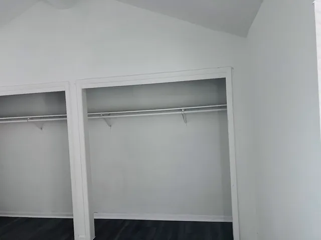 a view of an empty walk in closet