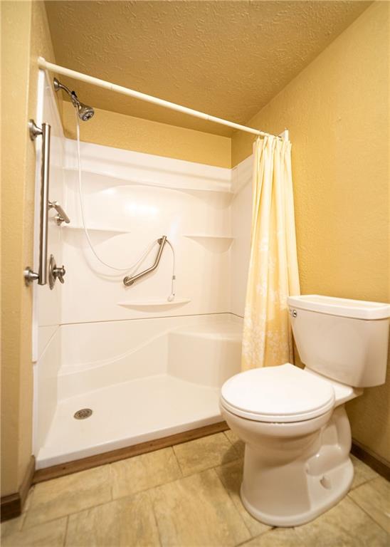 290 Schlemmer Road Rural Valley, PA 16249 - Photo 9 of 25 a bathroom with a toilet and a shower