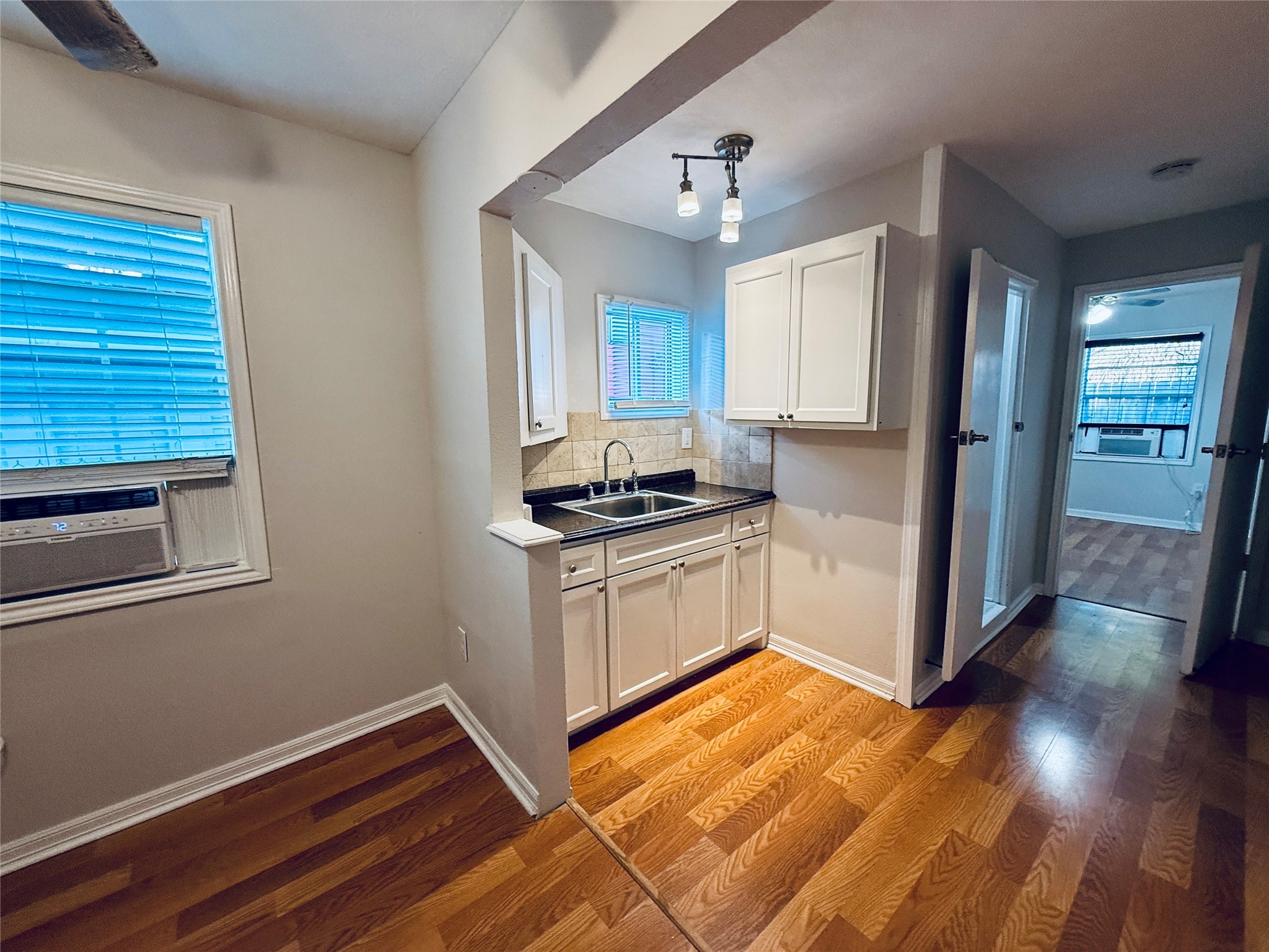 3921 Woodleigh Street, Unit 3 Houston, TX 77023 - Photo 2 of 6 a kitchen with a refrigerator and a stove top oven