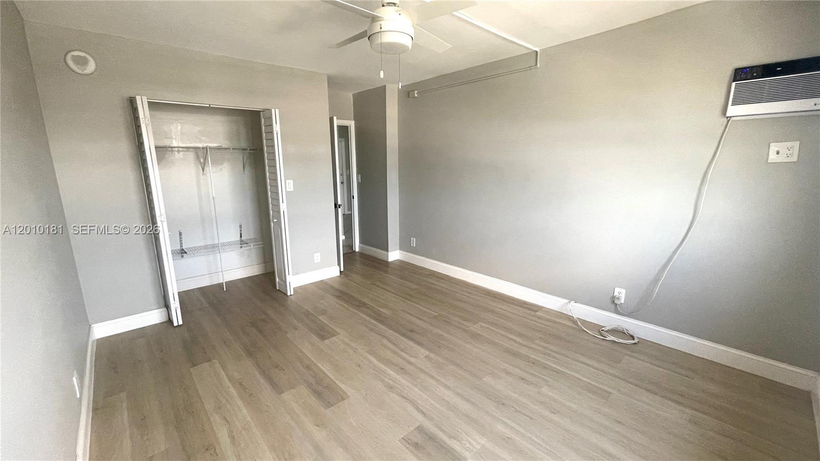 200 South Birch Road, Unit 604 Fort Lauderdale, FL 33316 - Photo 17 of 35 wooden floor in an empty room with a window