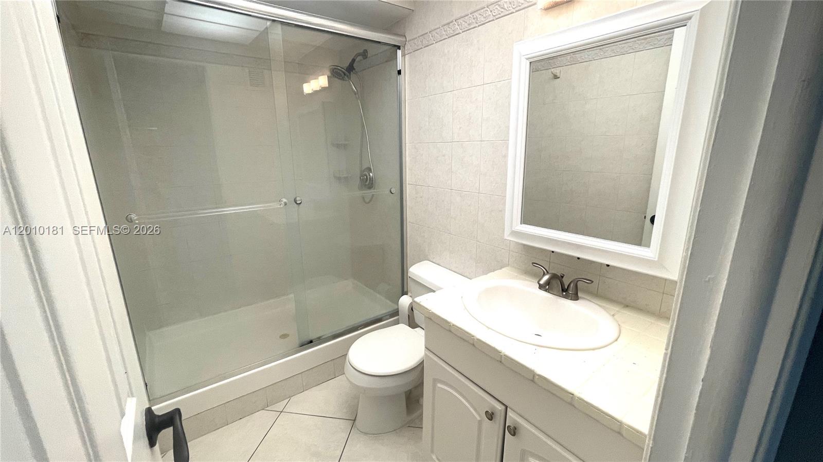200 South Birch Road, Unit 604 Fort Lauderdale, FL 33316 - Photo 21 of 35 a bathroom with a sink a toilet and shower