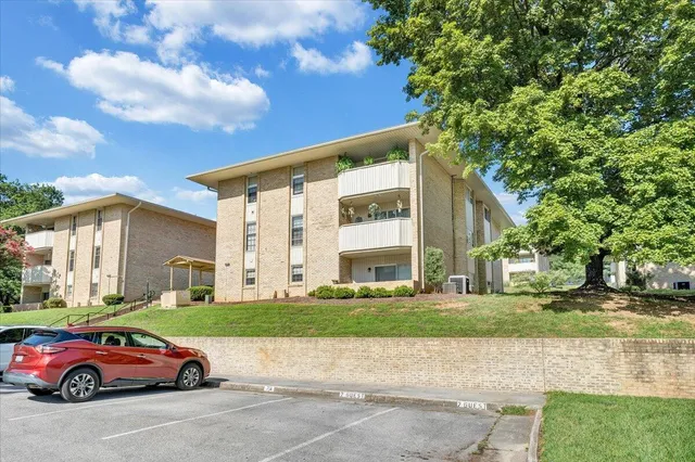 a view of house with yard and staircase