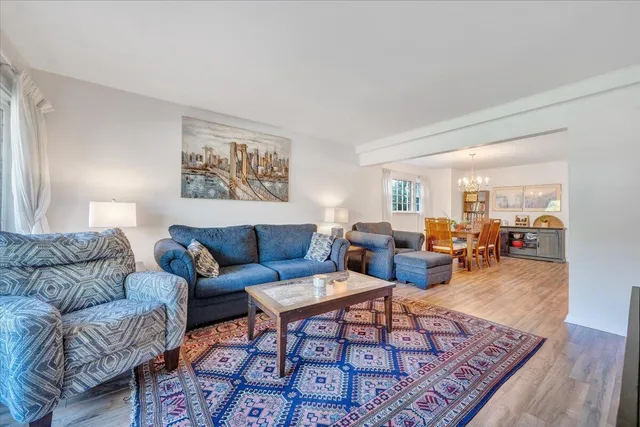 a living room with furniture or couch and a wooden floor