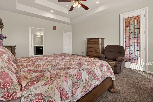 a bedroom with a bed and a chair