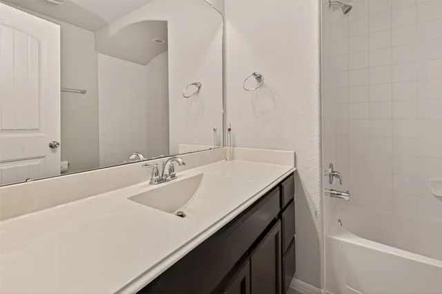 a bathroom with a sink and a bathtub