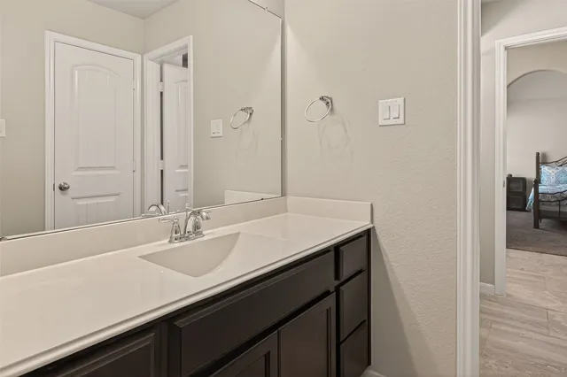 a bathroom with a sink and a mirror