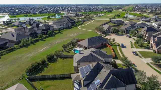 an aerial view of a house with a garden