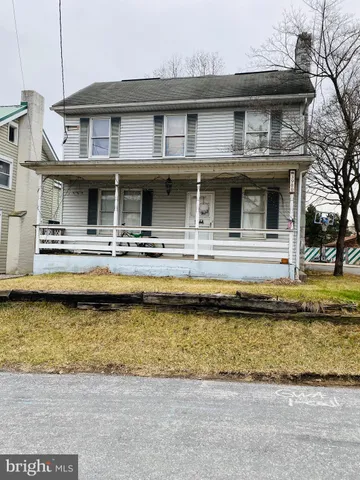 a front view of a house with swimming pool