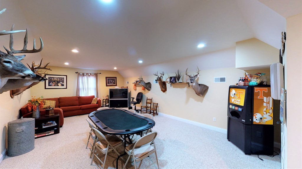1153 Reynolds Bridge Road Benton, TN 37307 - Photo 36 of 70 a living room with furniture and a table