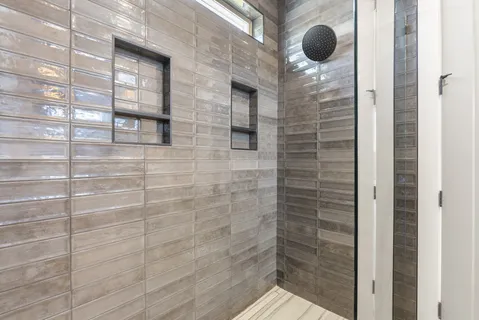 a bathroom with a sink toilet and a mirror