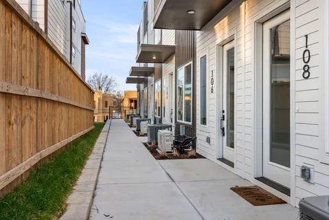 a kitchen with stainless steel appliances a refrigerator and a stove
