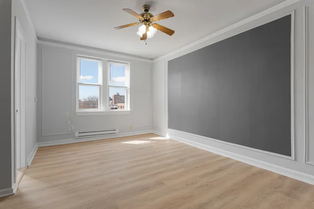 a view of an empty room with a window