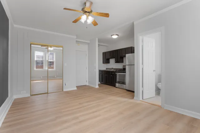 a view of a kitchen with a dishwasher cabinets and wooden floor