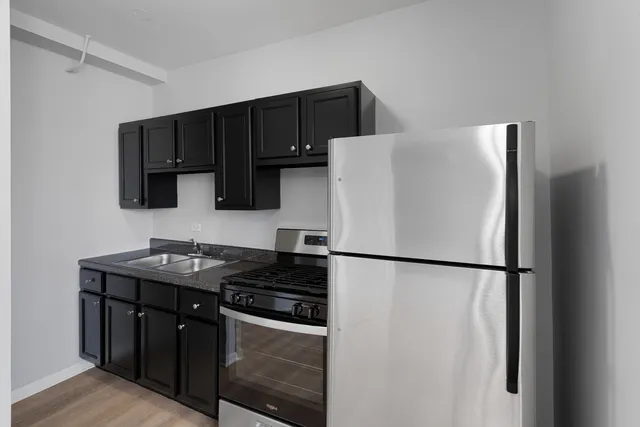 a white refrigerator freezer sitting inside of a kitchen