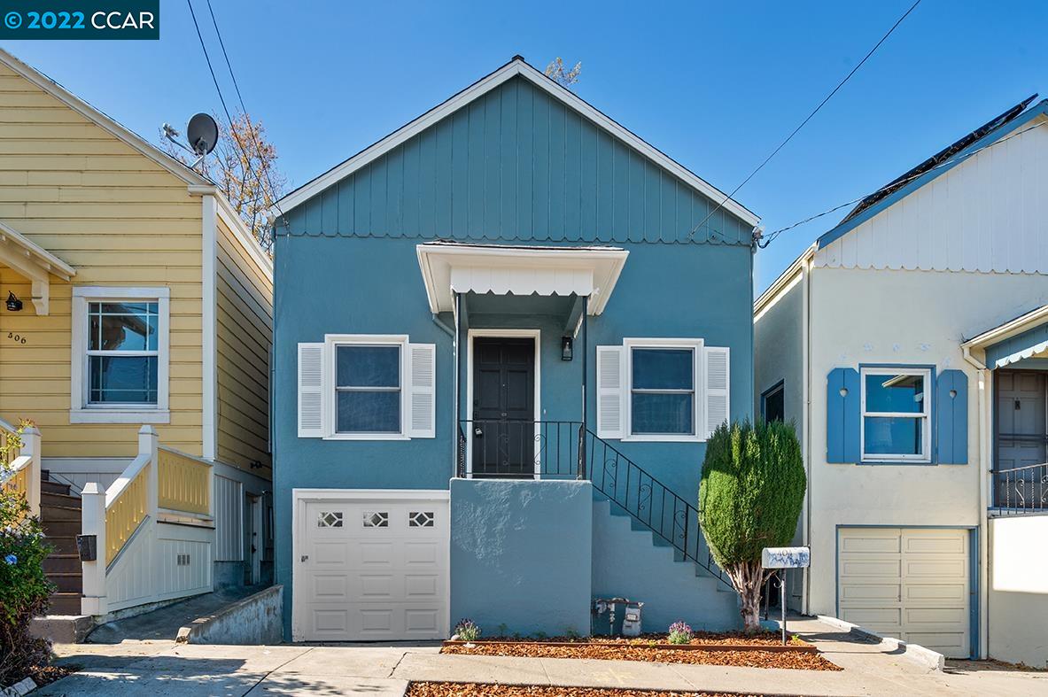 404 Lake Avenue Rodeo, CA 94572 - Photo 1 of 1 a front view of a house with garden