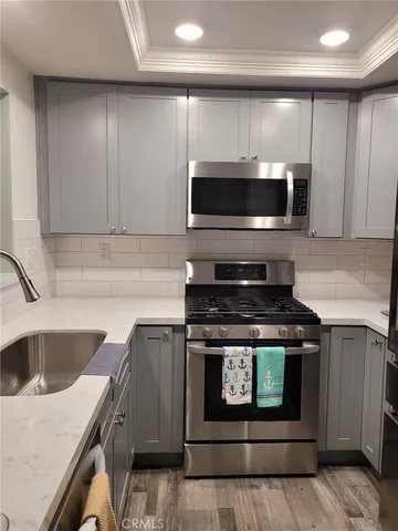 a kitchen with a stove and a microwave