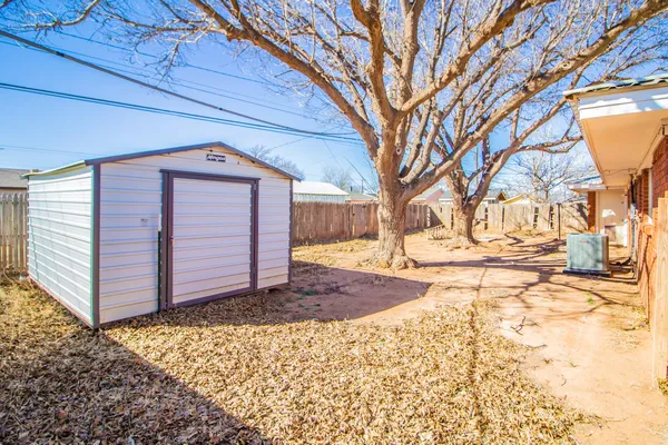 a view of a backyard of the house