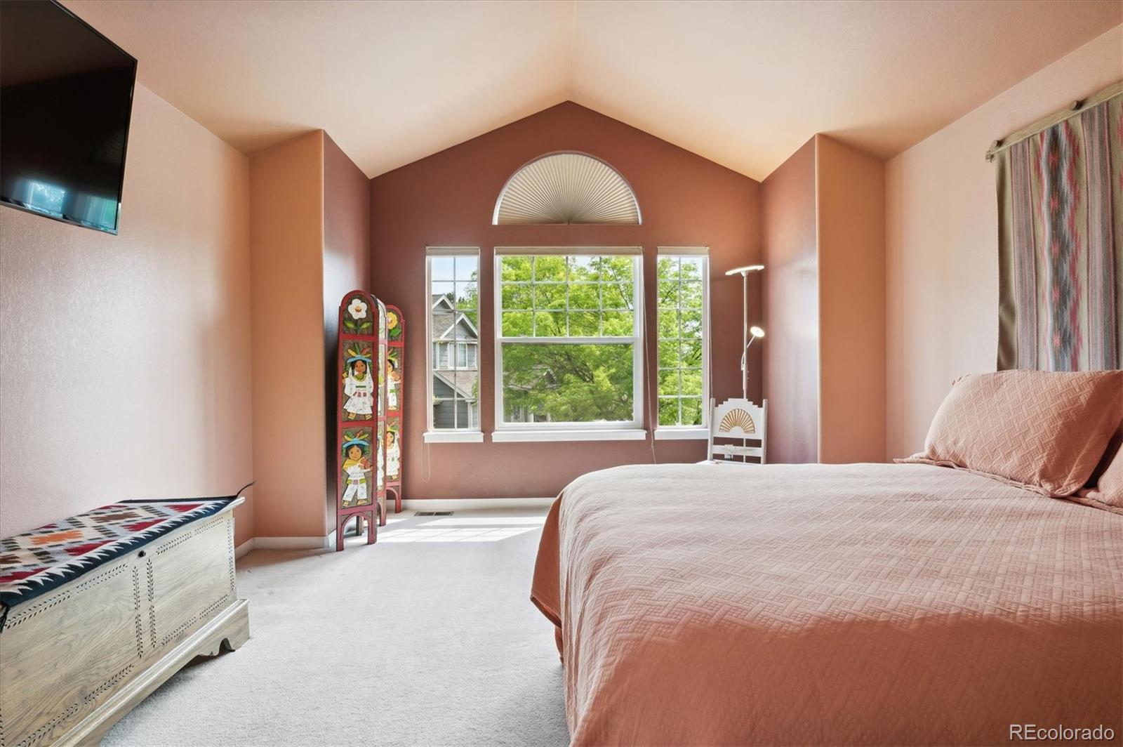 6381 Deframe Way Arvada, CO 80004 - Photo 19 of 22 a spacious bedroom with a bed and a window