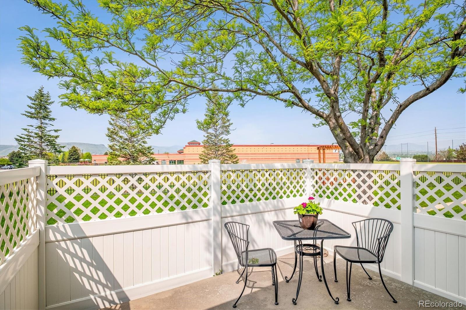 6381 Deframe Way Arvada, CO 80004 - Photo 8 of 22 a view of a chairs and table in the balcony