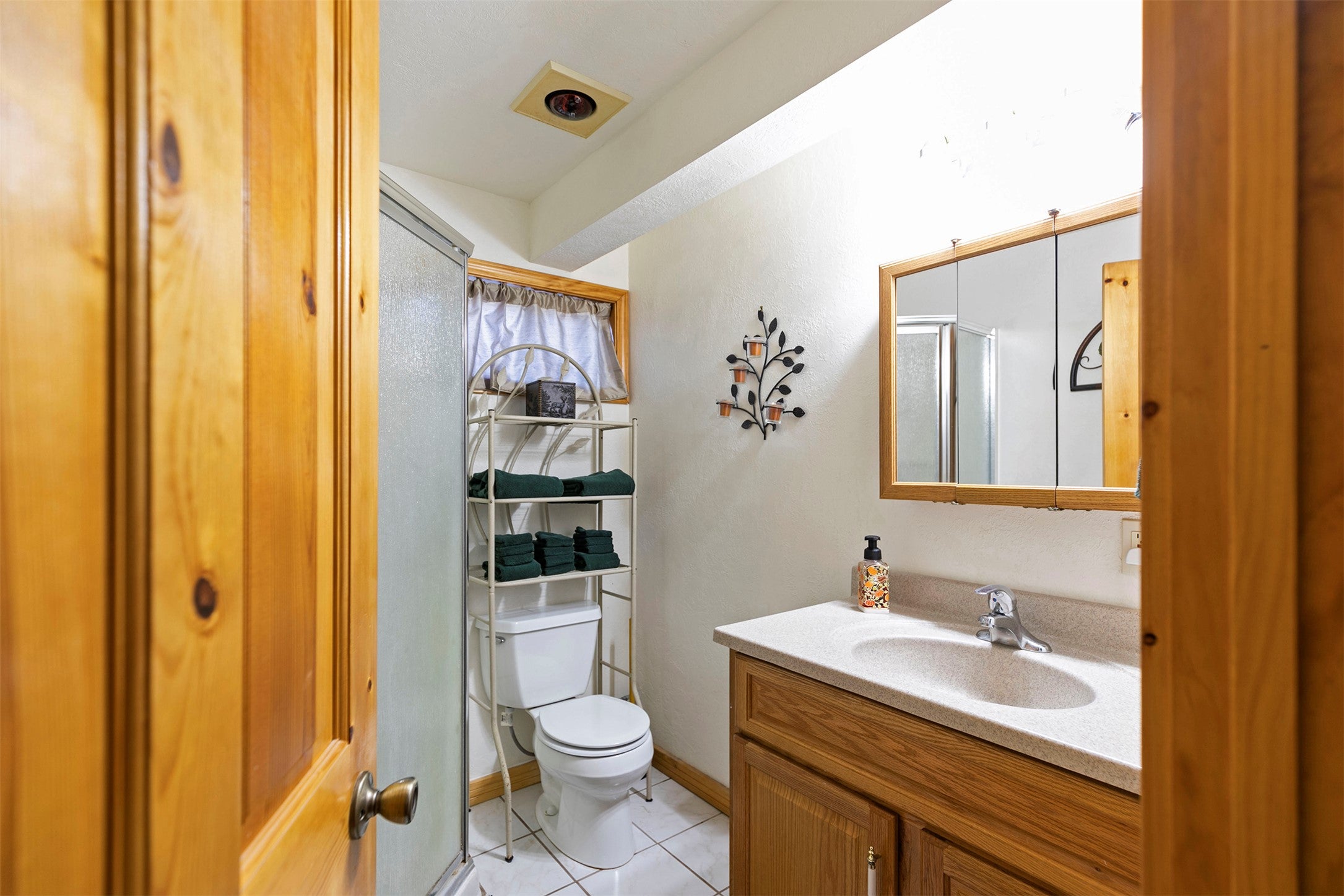 203 Hart Bench Road Darby, MT 59829 - Photo 28 of 56 Designed with comfort in mind, the basement bathroom is both roomy and welcoming, perfect for guests.