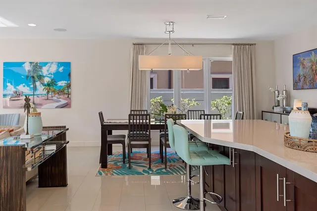 a living room with furniture a lamp and a large window