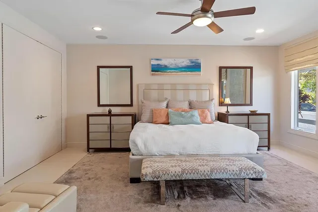 a large bathroom with a tub and sink
