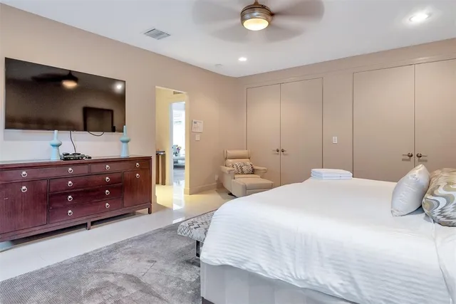 a view of walk in closet with clothes