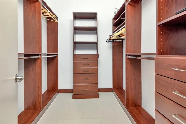 a bedroom with a bed and lamp