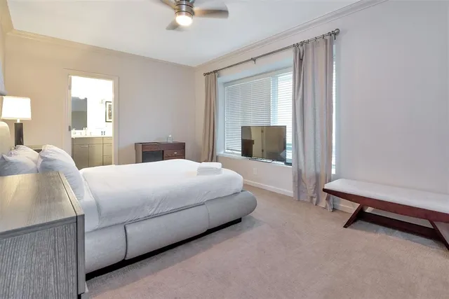 a bedroom with a bed and tv