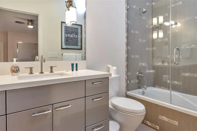 a large bed sitting in a bedroom and lamp