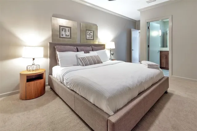 a spacious bedroom with a bed and a couch