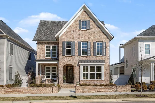 a front view of a building with sitting area