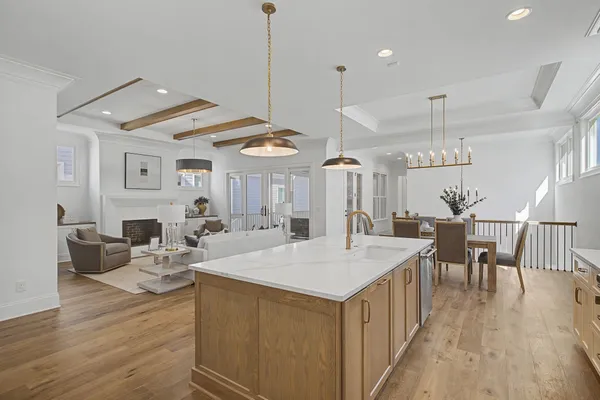 a kitchen with a center island appliances and cabinets