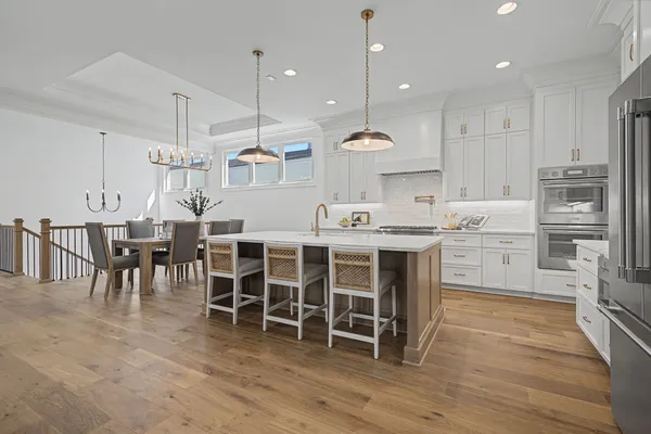 a stove top oven sitting inside of a kitchen
