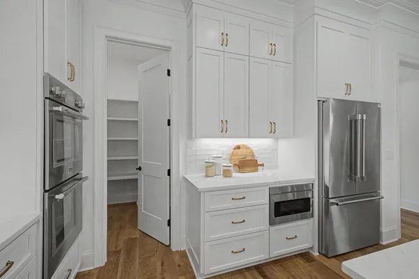 a view of an empty room and wooden floor