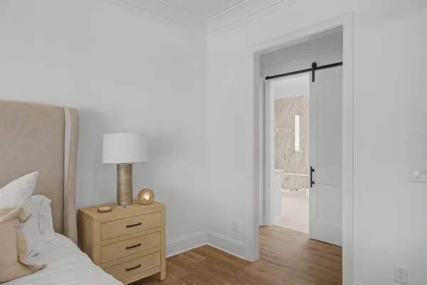 a view of staircase with railing and a rug