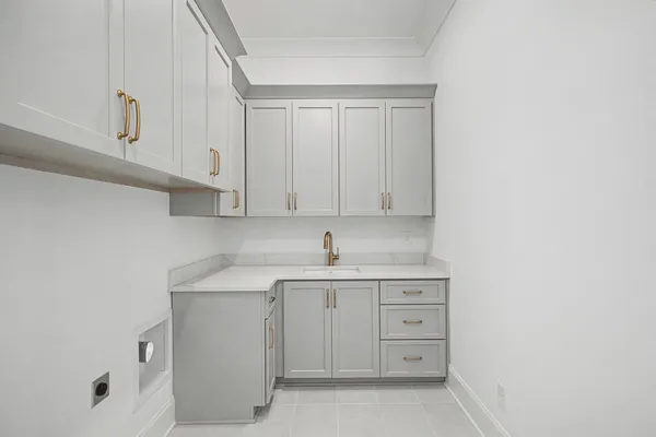 a view of cabinets a sink and a mirror