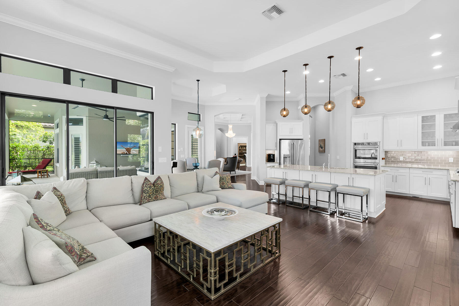 3193 Olympia Lane Naples, FL 34114 - Photo 14 of 50 a living room with furniture and a large window