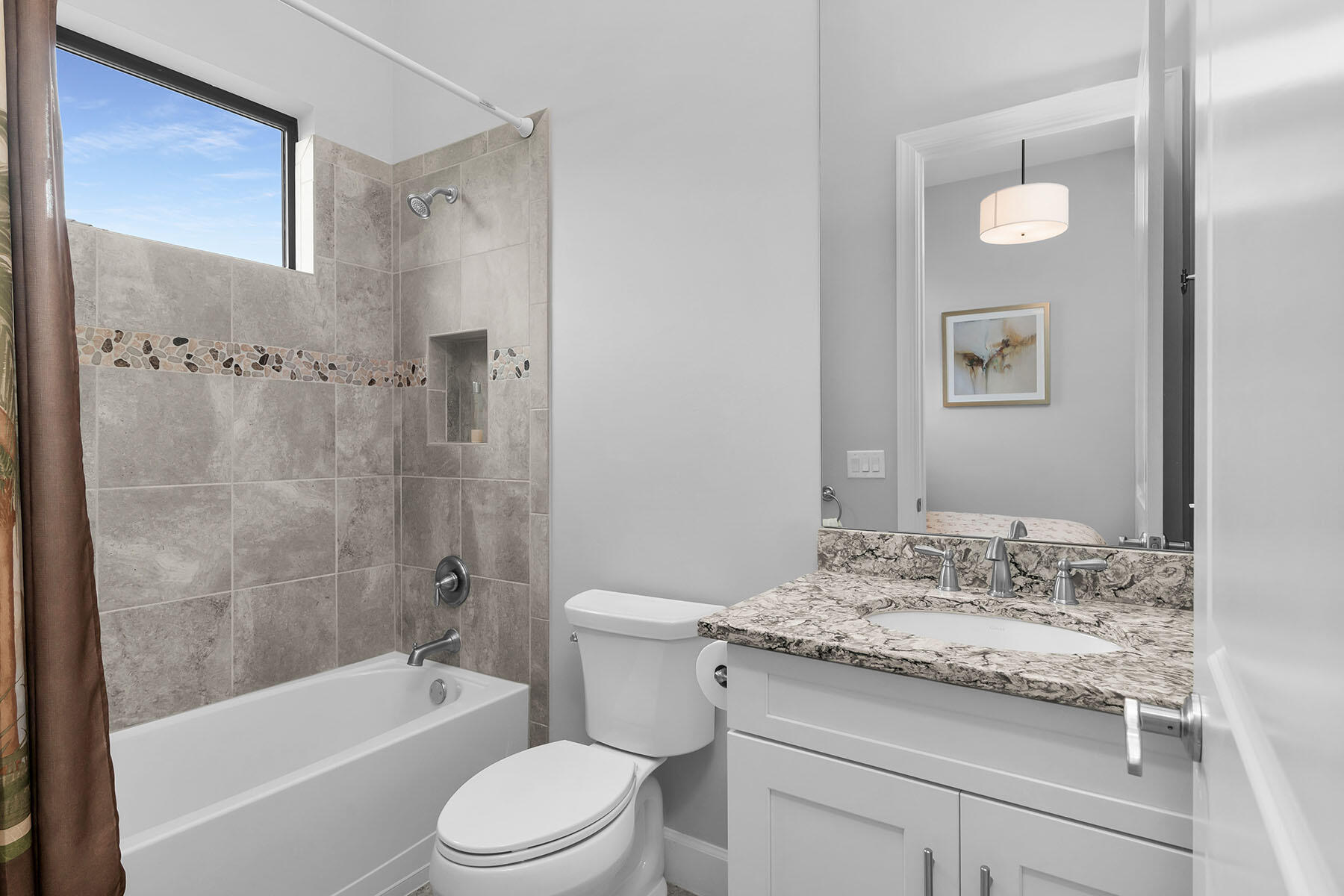 3193 Olympia Lane Naples, FL 34114 - Photo 20 of 50 a bathroom with a granite countertop toilet a sink and bathtub