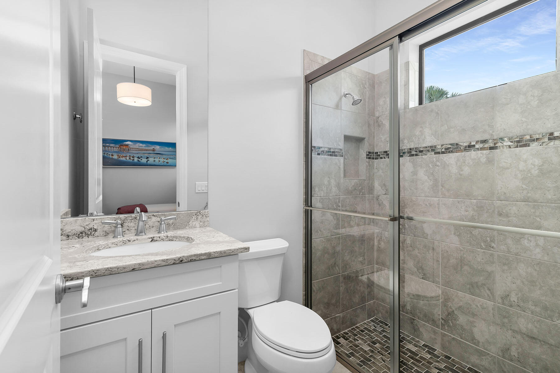 3193 Olympia Lane Naples, FL 34114 - Photo 22 of 50 a bathroom with a sink a toilet and shower