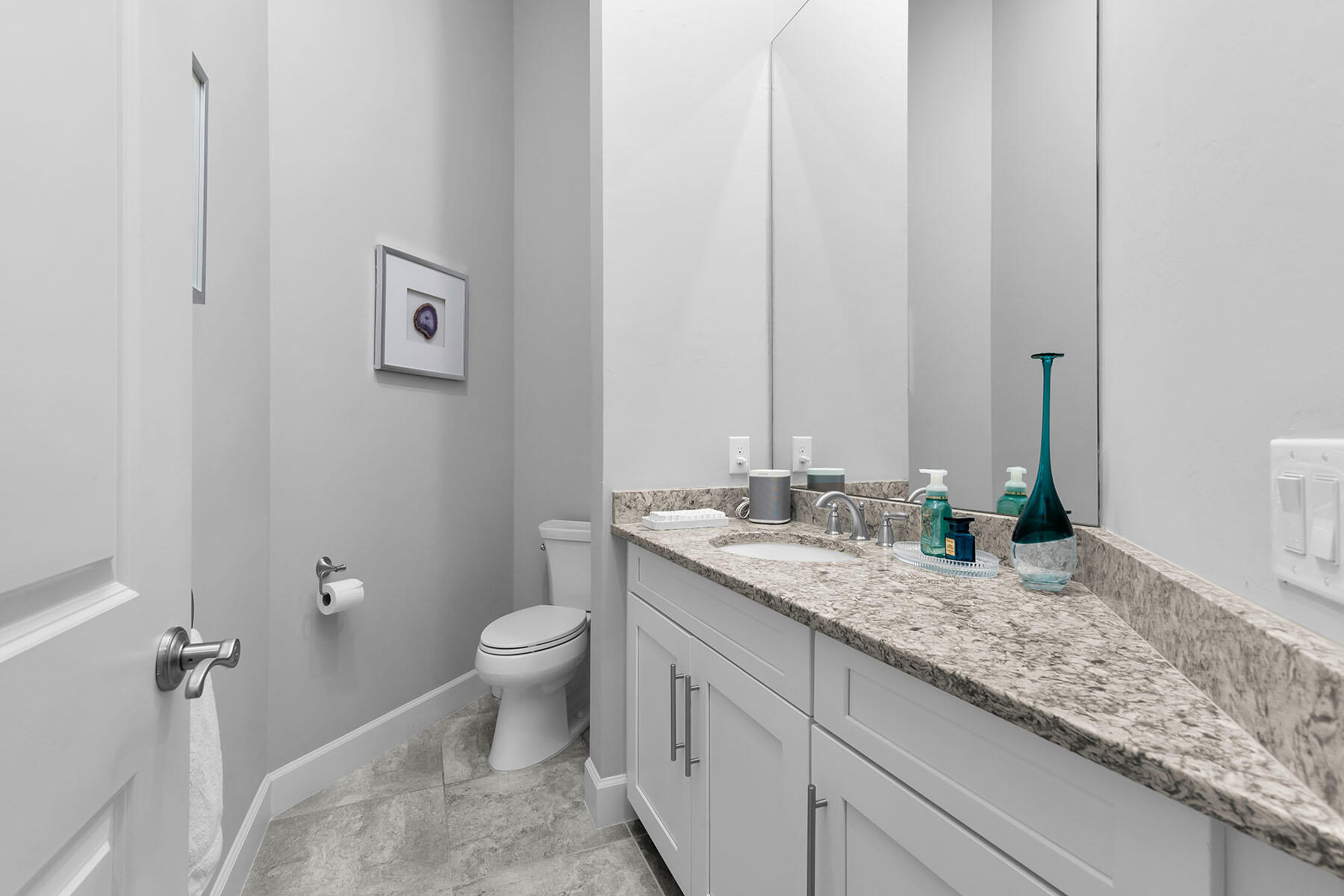 3193 Olympia Lane Naples, FL 34114 - Photo 24 of 50 a bathroom with a granite countertop sink a toilet and a mirror