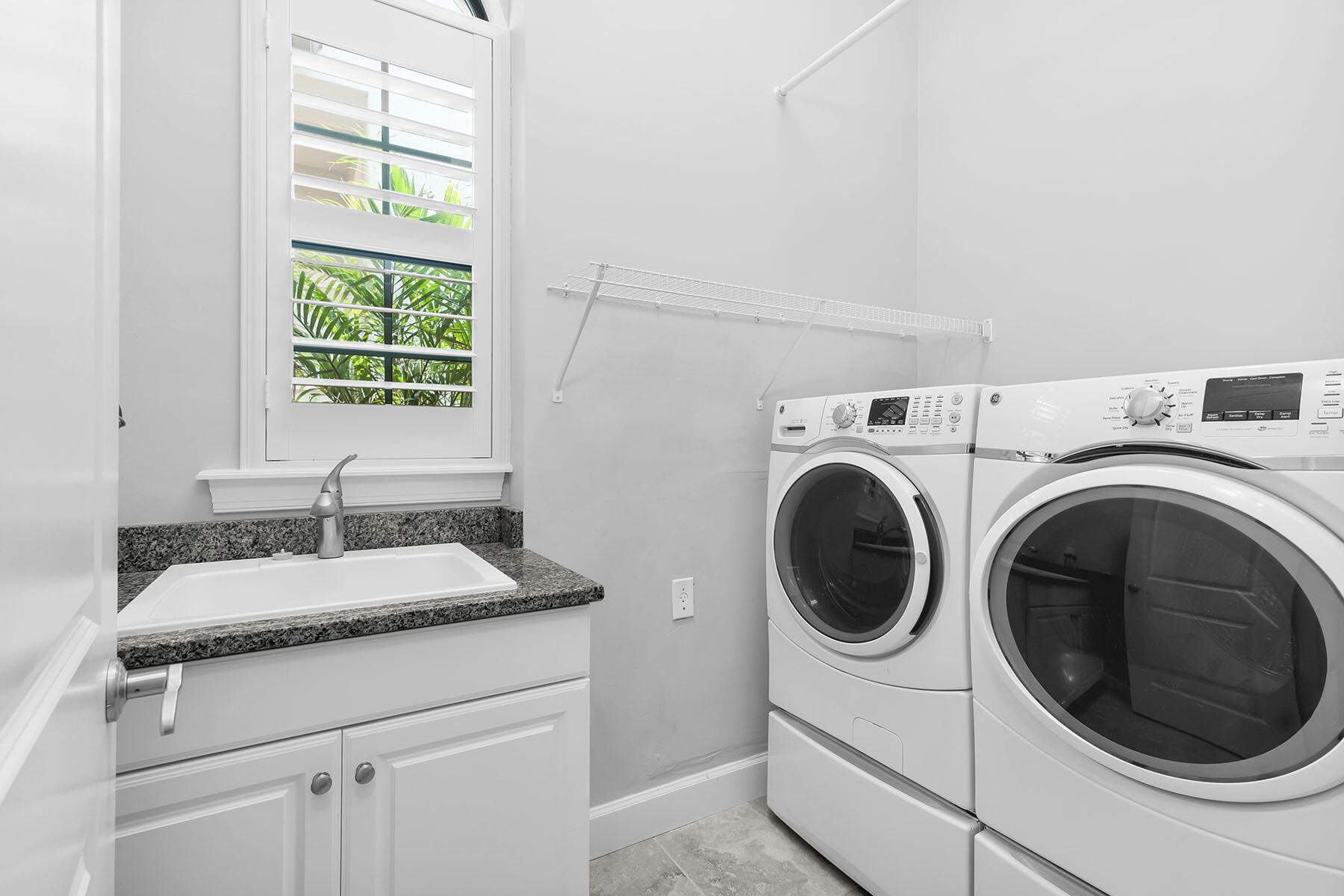 3193 Olympia Lane Naples, FL 34114 - Photo 25 of 50 a utility room with sink dryer and washer