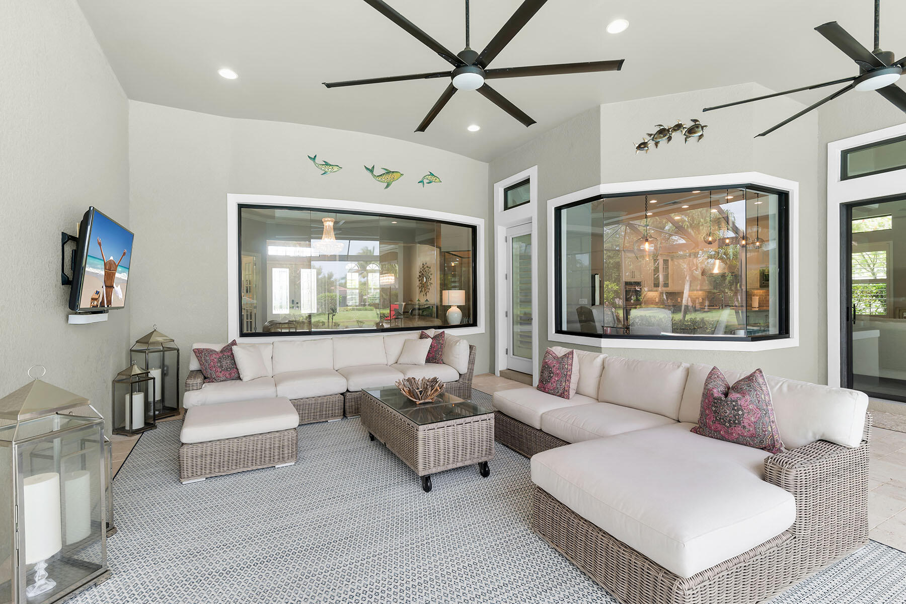 3193 Olympia Lane Naples, FL 34114 - Photo 27 of 50 a living room with furniture and a large window