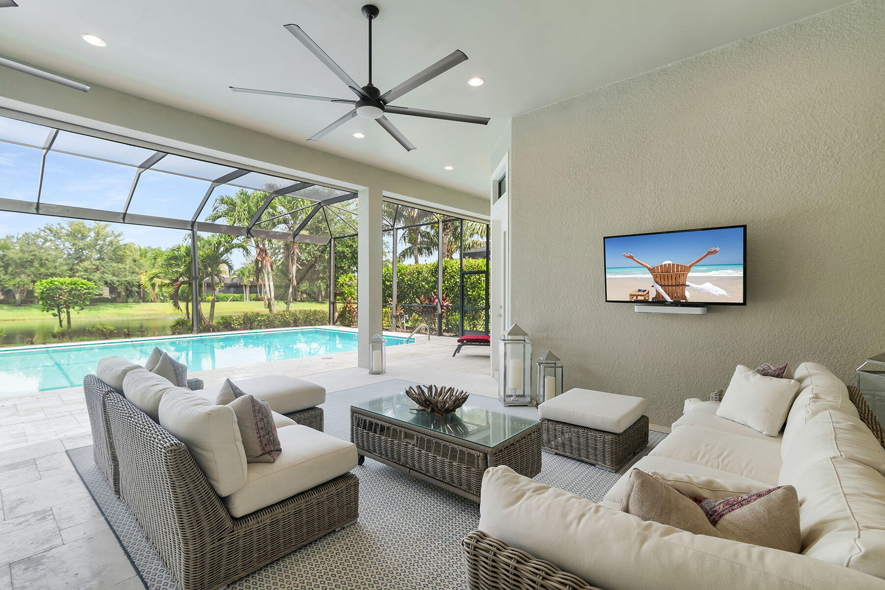 3193 Olympia Lane Naples, FL 34114 - Photo 28 of 50 a living room with furniture and a large window