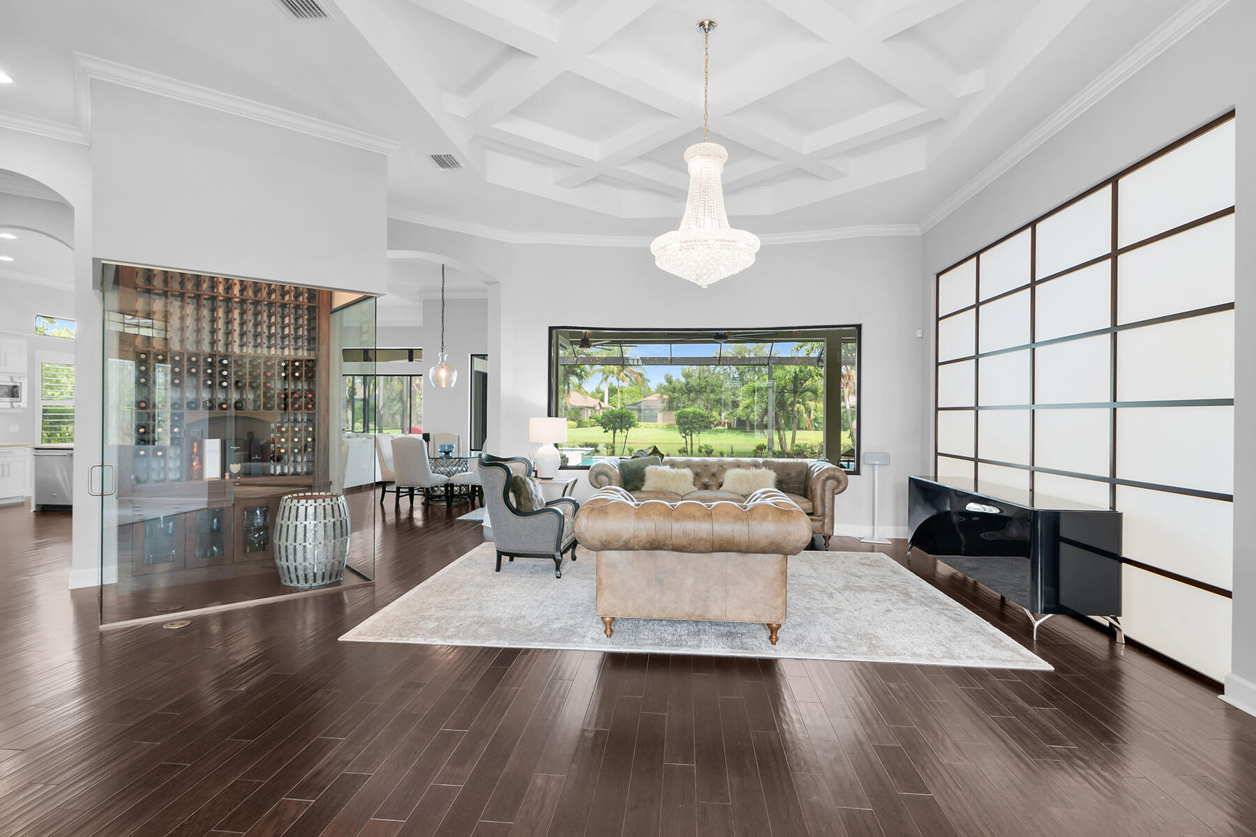 3193 Olympia Lane Naples, FL 34114 - Photo 3 of 50 a living room with furniture large window and wooden floor