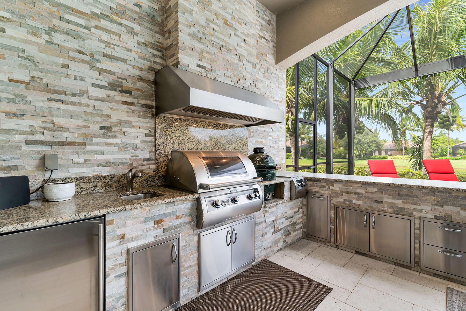 3193 Olympia Lane Naples, FL 34114 - Photo 31 of 50 a kitchen with stainless steel appliances granite countertop a sink and a stove