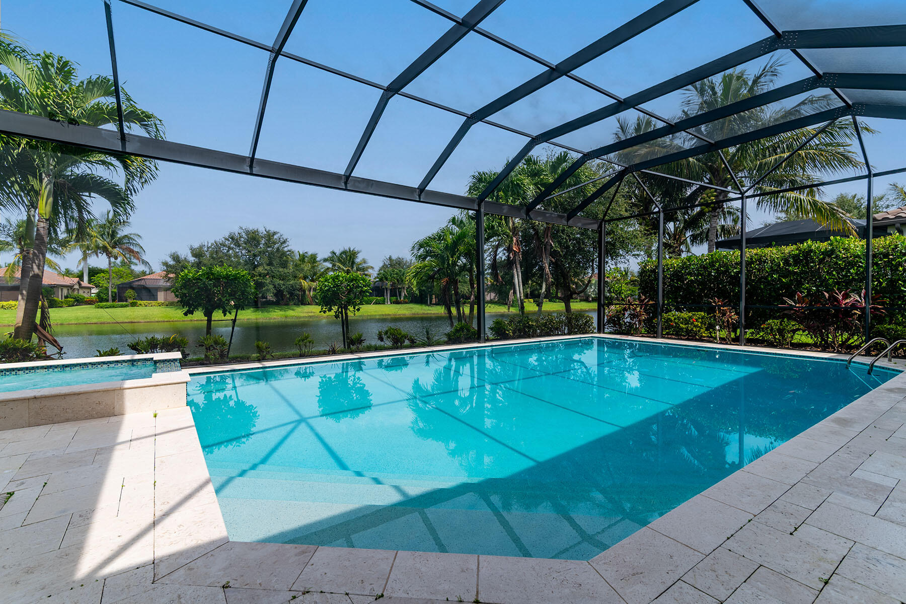 3193 Olympia Lane Naples, FL 34114 - Photo 34 of 50 a view of a swimming pool with a patio